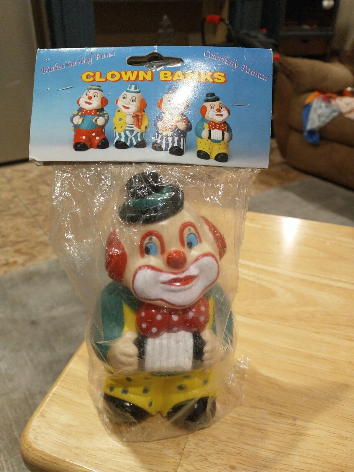 vintage plastic clown bank in orginal package. Approx. 7